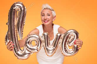 Attractive middle aged woman with love letters.