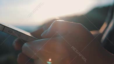 Close-up of a hand typing sms on a smartphone. Online surfing in social networks. Communicate with friends using your