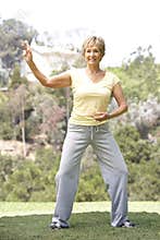 Senior Woman Exercising In Park
