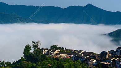 Aerial view of floating sea of clouds like cloud waves in mountains in early morning
