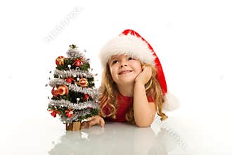 Little girl dreaming about christmas