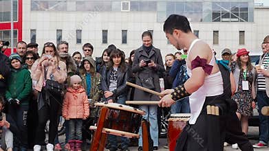 Moscow, Russia - April 24, 2016: Hinode Fest in Moscow. Musicians drummers play taiko drums chu-daiko outdoors. Culture