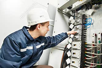 Electrician switching on power line box