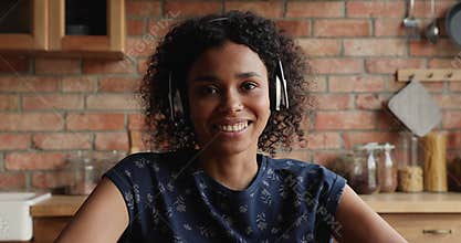 Screen view Black female wear headphones talk in conference app