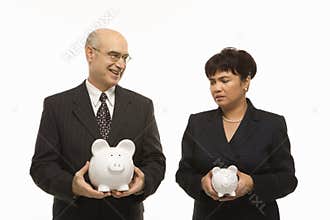 Businesspeople with piggybanks