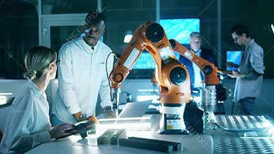 Computer laboratory with researchers experimenting with robots