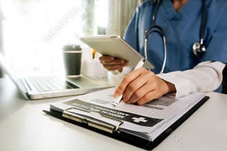 Medical technology concept The doctor works with mobile phones, headphones and tablets