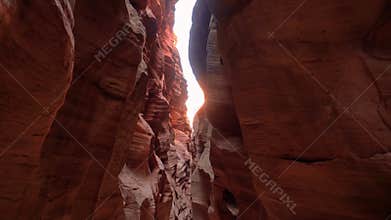 Mysterious Deep Slot Canyon With Curved And Smooth Orange Red Stone Rock Walls