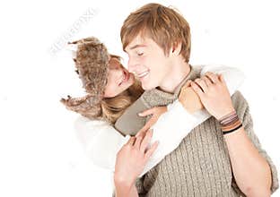 Young couple, girl kissing her boyfriend