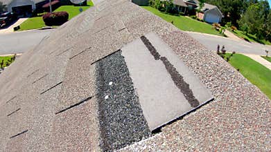 Roof shingles damaged in storm