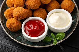 Meat free vegetarian mini picnic scotch eggs with micoprotein and herbs served with ketchup and mayonnaise