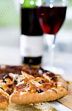 Pizza slice and wine