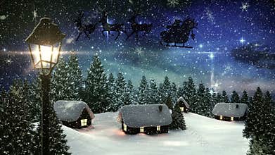 Snowflakes falling over houses and trees on winter landscape against shining stars in night sky