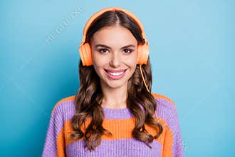 Portrait of attractive cheerful girl listening different rock music free time isolated over bright blue color background