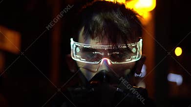 Male in protective mask. Cyberpunk style, high technology and a fantastic future