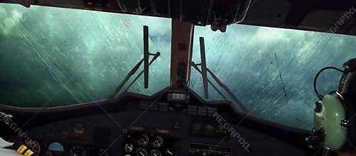 Plane in storm, clouds. Cockpit. Rain streams, windscreen