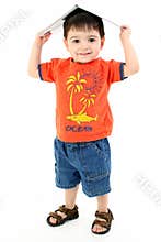 Adorable Toddler Boy With Book On Head