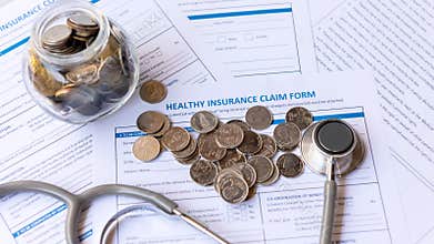 Saving money for insure Health insurance for healthy care form and protection people life with stethoscope.