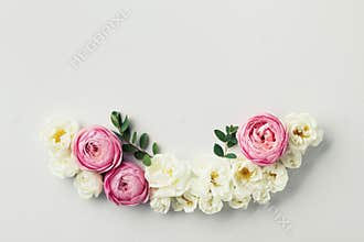 Beautiful floral arrangement with white and pink rose flowers for wedding card. Top view and flat lay style