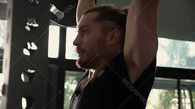 Young caucasian man work out in fitness gym with motivation and determination.