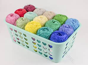Box with colorful knitting yarn