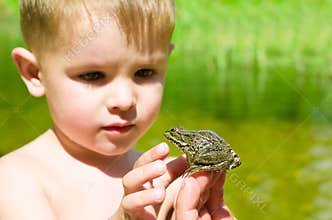 Acquaintance a little boy with a frog