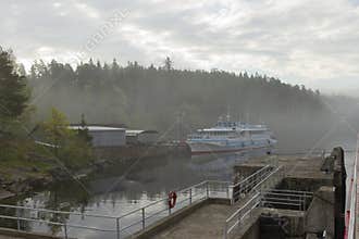 A ship at the pier on a misty gray morning