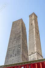 The ancient Asinelli and Garisenda towers, symbol of Bologna, Italy, are closed by red barriers for ongoing restoration work