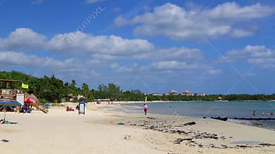 Tropical Caribbean beach people parasols fun Playa del Carmen Mexico