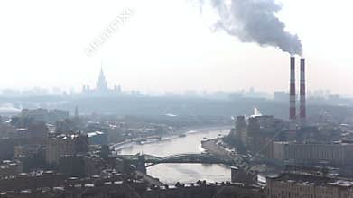 Two pipes let out smoke clubs, bridge through the