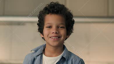 Little boy happy African American ethnic child son toddler baby face smiling emotions schoolboy school kid junior orphan