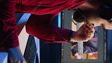 Vertical video Videographer operating computer editing systems and equipment