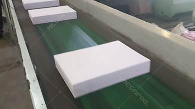 Cut pack A4 sized copier papers are passing though conveyor belt