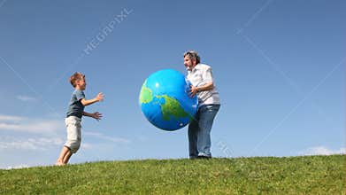 senior throws, his grandson beats large inflatable