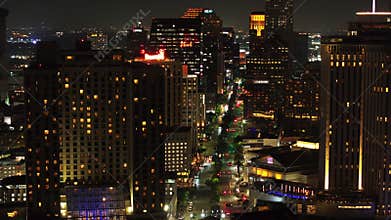 Impressive aerial view of Canal Street in downtown New Orleans at night, with brightly lit buildings in a lively