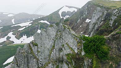 Mountains spring snow stone rock clouds sky background