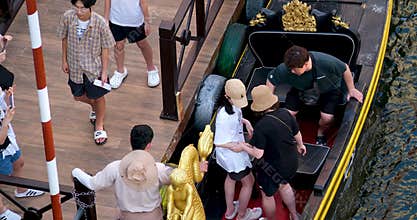 Phu Quoc Island Vietnam 06.16.2024 feminism girl refuses man hands that give hand when she climbs into boat into gondola