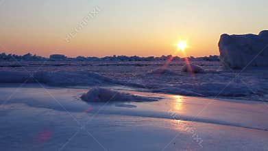 Frozen sea at dawn. Shot with a slider.