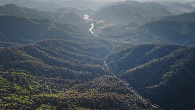 River flowing through forested valley in Chiang Mai Province, Thailand