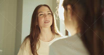 Mother engaging daughter with gentle expressions and nurturing warmth