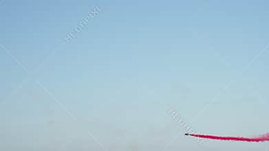 Aerobatic Jets Crossing with Colored Smoke