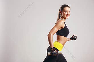 Female Fitness Model with dumbbells