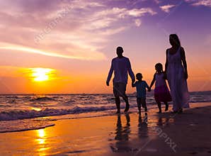 Family walking on the beach