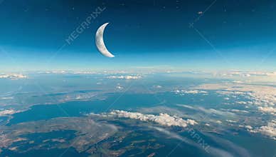 Crescent moon shines brightly above earth\'s atmosphere with clouds and land visible below