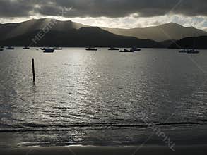 New Zealand: Akaroa harbour with distant sunlit clouds