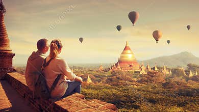 Young couple in summer vacation travels around Asia