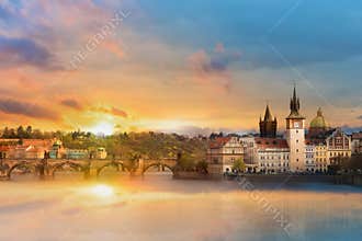 Scenic summer view of the Old Town buildings, Charles bridge and Vltava river in Prague during amazing sunset, Czech Republic