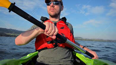 Caucasian Sportsman Kayak Tour on the Lake. Kayaking Theme.