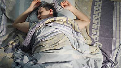 A Man Wakes From Nightmare, Bad Dream and Restless Sleep At Night