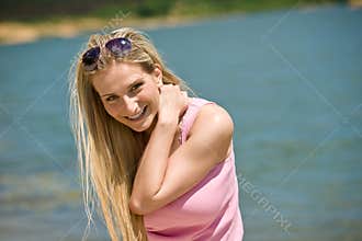 Happy blond woman enjoy summer sun